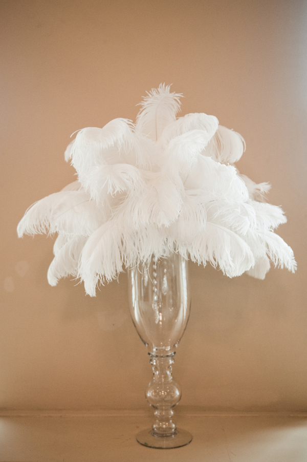 Bouquet of white feathers in a clear slender vase - photo by Portland wedding photographer Barbie Hull 